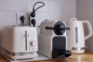 a kitchen counter with a coffee maker and a toaster at La maison d'à côté 3 - 6 people - 3 bedrooms - 2 bathrooms in Honfleur