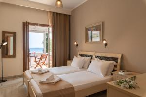 A bed or beds in a room at Krioneri Beach