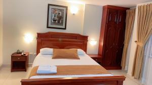 Voodi või voodid majutusasutuse Hotel Caluva toas