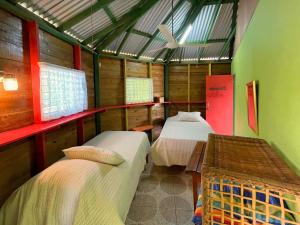 a room with two beds in a room at Judy House Two in Little Bay