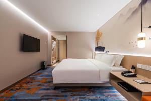 TV a/nebo společenská místnost v ubytování Sunworld Hotel Wangfujing