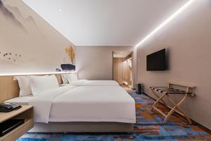 TV a/nebo společenská místnost v ubytování Sunworld Hotel Wangfujing