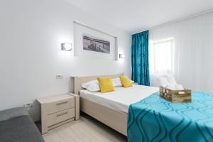 Postel nebo postele na pokoji v ubytování Irish Residence