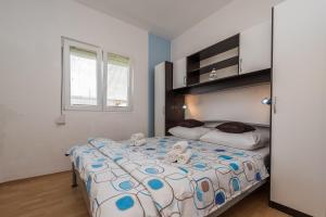 Postel nebo postele na pokoji v ubytování Apartments Marko Dominik