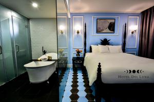 Postel nebo postele na pokoji v ubytování Hotel Del Luna Boutique