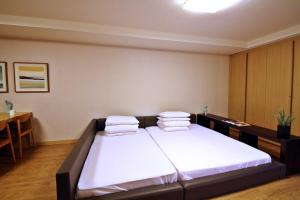 Postel nebo postele na pokoji v ubytování Luceville