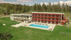 an aerial view of a building with a swimming pool at Siljansnäs Hotell in Siljansnäs