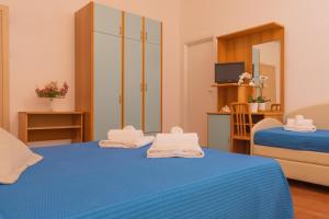 Postel nebo postele na pokoji v ubytování Hotel Merano