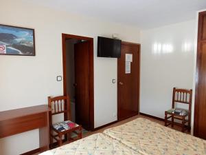 Postel nebo postele na pokoji v ubytování Hotel Costa Cántabra