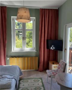 a bedroom with a bed and a window at Willa Halinówka in Krynica Zdrój +53 photos