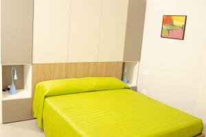 מיטה או מיטות בחדר ב-Solemare Casa Vacanze