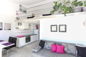 a living room with a couch and a table at Apartment in Tribunj with sea view, balcony, air conditioning, WiFi 4953-4 in Tribunj +33 photos