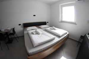 Postel nebo postele na pokoji v ubytování Apartma Deni