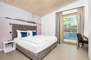 Postel nebo postele na pokoji v ubytování Apartment Velden - 24 Home im Zentrum