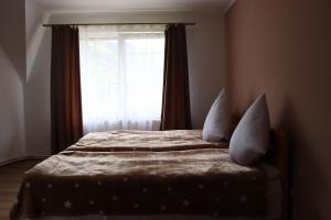 Postel nebo postele na pokoji v ubytování Сільська Садиба