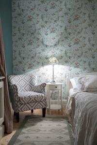 a bedroom with a bed and a chair and a table at Puhek breg in Krapina +42 photos