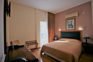 Posteľ alebo postele v izbe v ubytovaní Adams Hotel