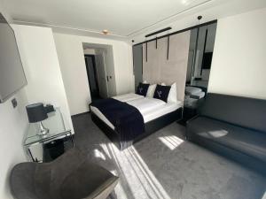 Łóżko lub łóżka w pokoju w obiekcie The Place Boutique & Design Hotel Flachau