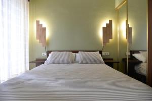 Postel nebo postele na pokoji v ubytování Hostal Concejo
