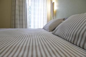 Postel nebo postele na pokoji v ubytování Hostal Concejo