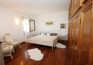 Ένα ή περισσότερα κρεβάτια σε δωμάτιο στο Villa Carla
