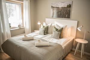 Säng eller sängar i ett rum på Sky Hotel Apartments Valla Berså