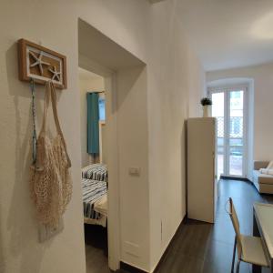 A bed or beds in a room at Vista sul carruggio, centro storico di Chiavari