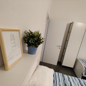 A bed or beds in a room at Vista sul carruggio, centro storico di Chiavari