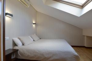 Postel nebo postele na pokoji v ubytování Hostal Concejo