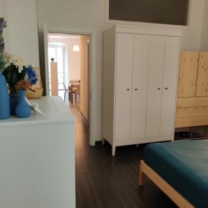 A bed or beds in a room at Vista sul carruggio, centro storico di Chiavari
