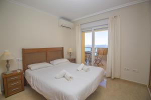 Säng eller sängar i ett rum på Spanish Connection - Playa Principe