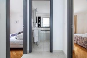 Postel nebo postele na pokoji v ubytování Edone' by PortofinoHomes
