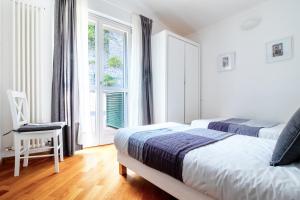 Postel nebo postele na pokoji v ubytování Edone' by PortofinoHomes