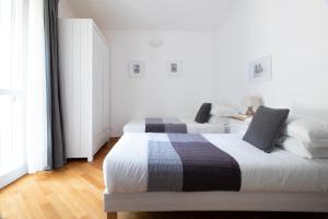 Postel nebo postele na pokoji v ubytování Edone' by PortofinoHomes