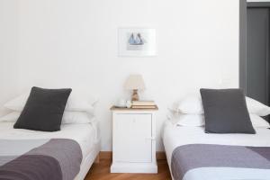 Postel nebo postele na pokoji v ubytování Edone' by PortofinoHomes