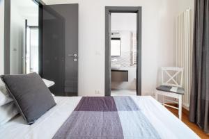 Postel nebo postele na pokoji v ubytování Edone' by PortofinoHomes