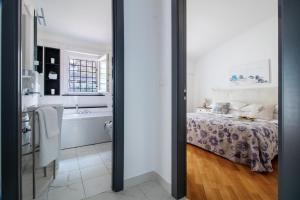Postel nebo postele na pokoji v ubytování Edone' by PortofinoHomes