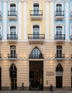 a facade of a building with windows and balconies at Hospes Amérigo, Alicante, a Member of Design Hotels in Alicante