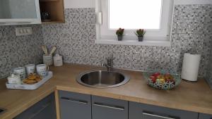 Kuchyň nebo kuchyňský kout v ubytování Urban Apartment Vukić + 12 fotografií
