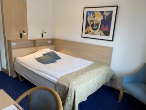 Voodi või voodid majutusasutuse Herning City Hotel toas