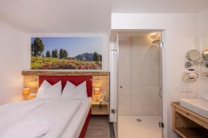 Postel nebo postele na pokoji v ubytování Genusshotel Almrausch