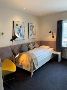 Voodi või voodid majutusasutuse Herning City Hotel toas