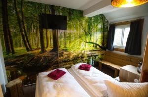 Postel nebo postele na pokoji v ubytování Berghotel Bärenstein
