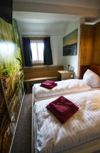 Postel nebo postele na pokoji v ubytování Berghotel Bärenstein