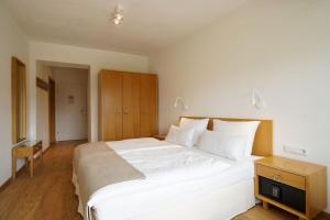 Letto o letti in una camera di Hotel Berghof