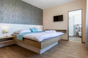 Posteľ alebo postele v izbe v ubytovaní Penzion a restaurace Feldsberg
