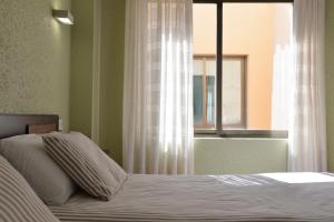Postel nebo postele na pokoji v ubytování Hostal Concejo