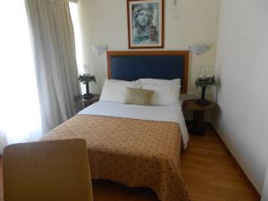 Postel nebo postele na pokoji v ubytování Adams Hotel