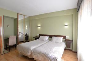 Postel nebo postele na pokoji v ubytování Hostal Concejo
