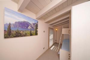 a bedroom with a bed and a painting on the wall at Gardaliva 5 in Manerba del Garda +36 photos